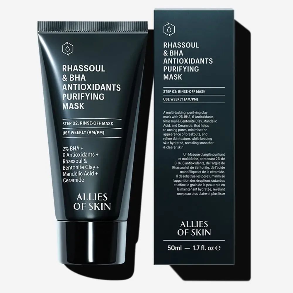 Schwarze Tube und Schachtel. Text: Rhassoul & BHA Antioxidants Purifying Mask. 50ml - 1.7 fl. oz. Auf der Schachtel: Produktbeschreibung.