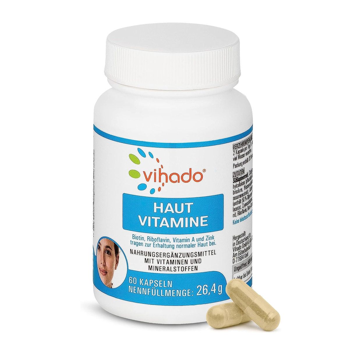 Eine weiße Flasche Vihado Haut Vitamine mit zwei Kapseln daneben. Auf der Flasche steht 'Haut Vitamine' und '60 Kapseln'. Die Flasche enthält Informationen über die Inhaltsstoffe und die empfohlene Dosierung.
