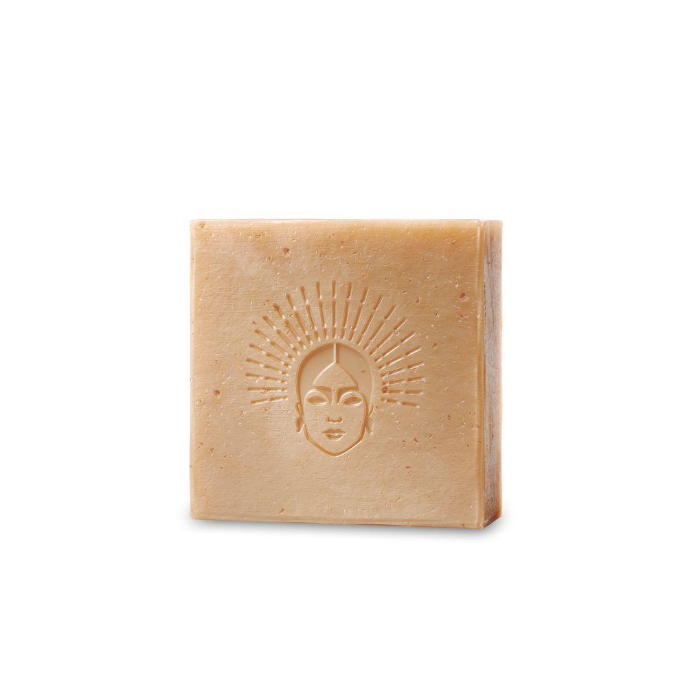 Viva Maia Nourishing Bar: Quadratische Seife mit eingeprägtem Gesichtssymbol.