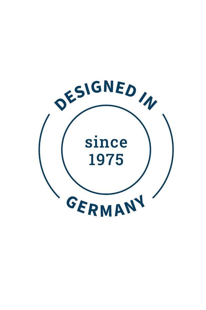 Rundes Logo mit Text: 'DESIGNED IN GERMANY' und 'since 1975'. Blau auf weißem Hintergrund.