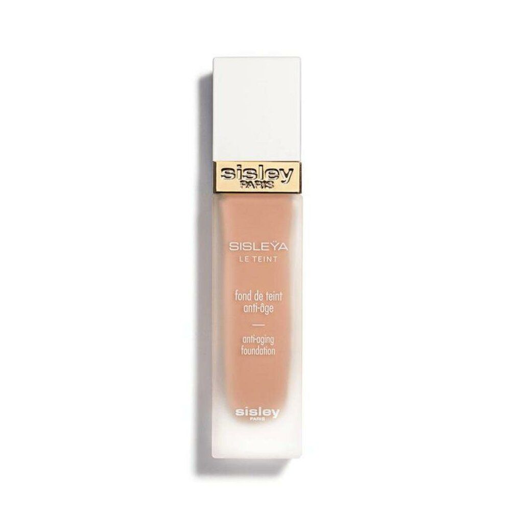Sisley Sisleya Le Teint Foundation. Rechteckige Flasche mit weißem Deckel. Goldener Schriftzug Sisley Paris.