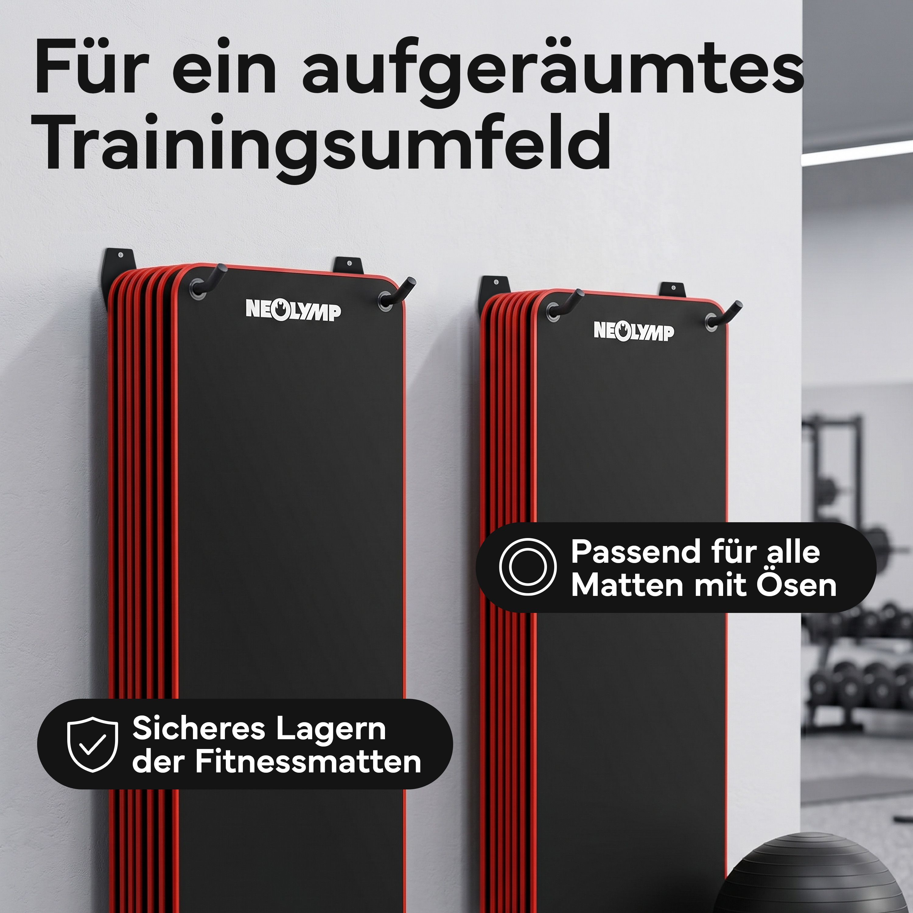 Zwei schwarze Wandhalterungen mit roten Akzenten für Fitnessmatten, passend für Matten mit Ösen.