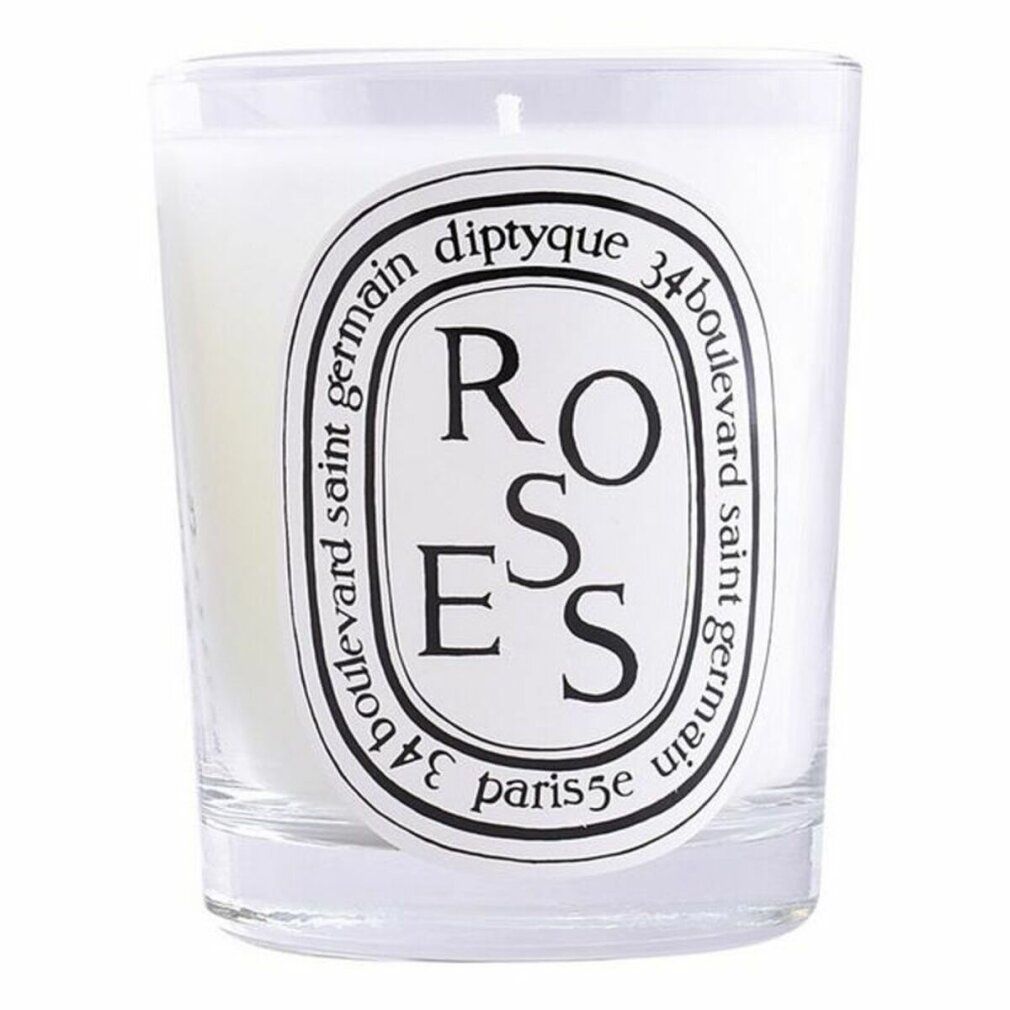 Duftkerze in Glas. Weißes Wachs, schwarzes Etikett mit Text: diptyque, ROSES, 34 boulevard saint germain, paris 5e.