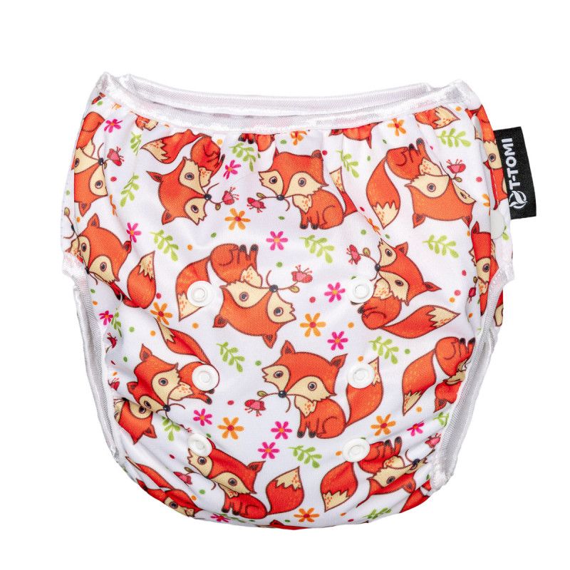 T-TOMI Schwimmwindel mit Fuchsmuster. Weiß mit orangefarbenen Füchsen, grünen Blättern und rosa Blumen. Seitliche Druckknöpfe. Schwarzes T-TOMI-Etikett.