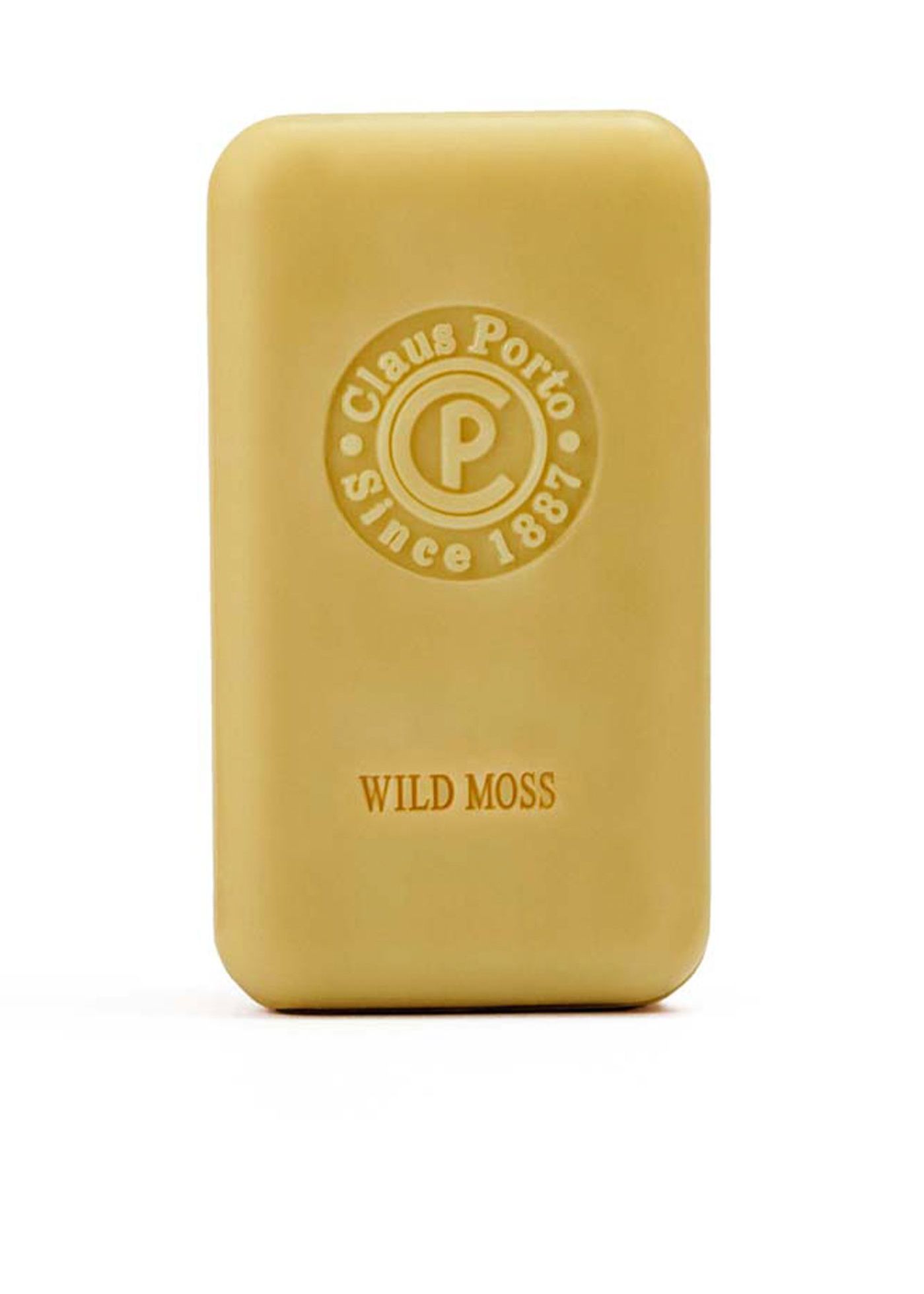Rechteckige Seife, hellgelb. Mit geprägtem Logo und Schriftzug "Wild Moss". Marke: Claus Porto.
