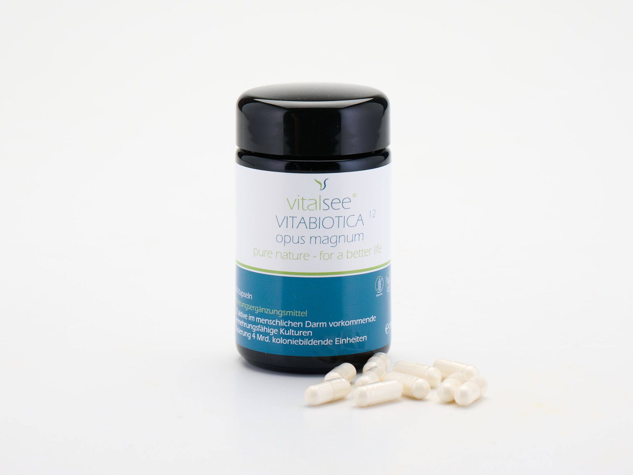 Vitalsee VITABIOTICA 12 opus magnum Behälter mit verstreuten Kapseln davor.