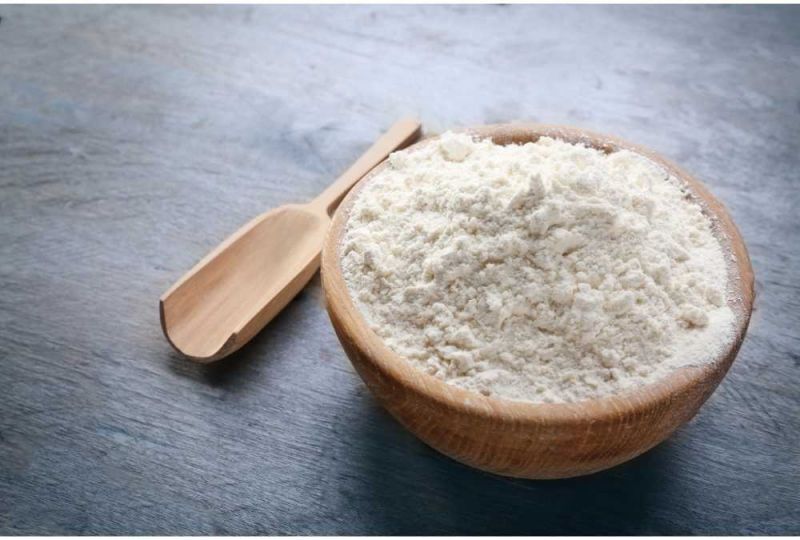 Braune Tüte mit weißem Etikett. Aufschrift: nur.fit BIO Vegan Protein 2 K. Abbildung von Erbsen und Körnern.