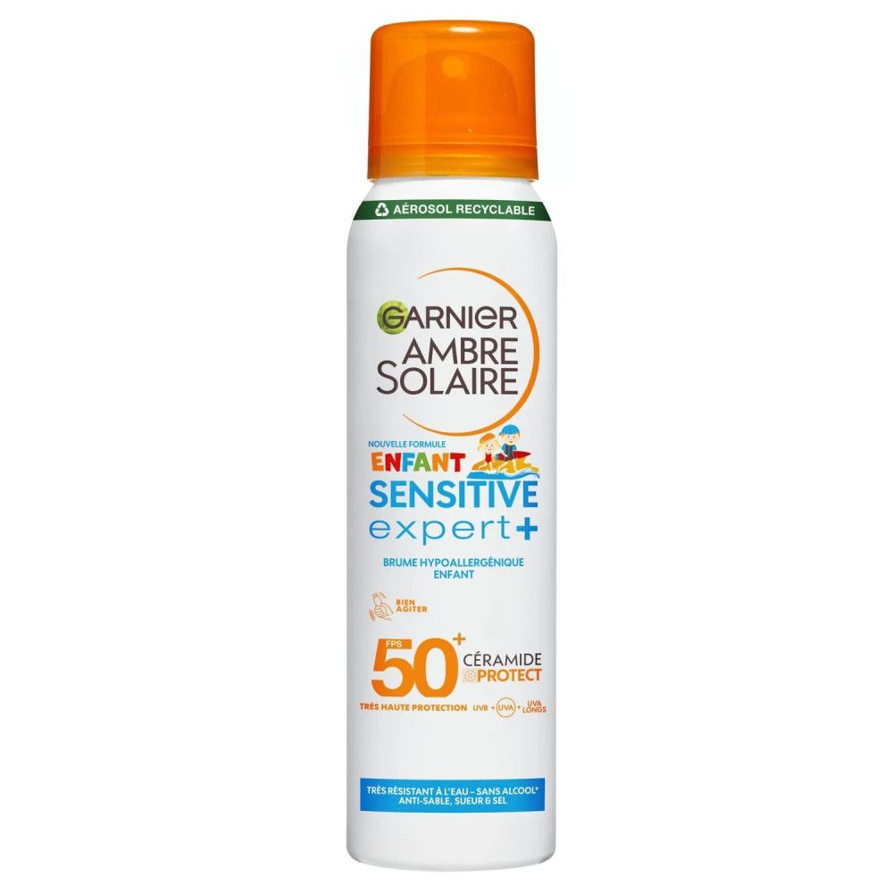 Weißes Spray mit orangefarbenem Deckel. Aufschrift: Garnier Ambre Solaire, Enfant Sensitive Expert+ SPF50.