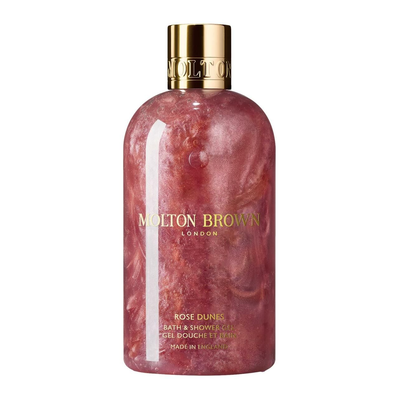 Molton Brown Rose Dunes Bade- & Duschgel. Rosa Flüssigkeit mit Glitzer in einer Flasche mit goldenem Verschluss. Markenlogo und Produktname.