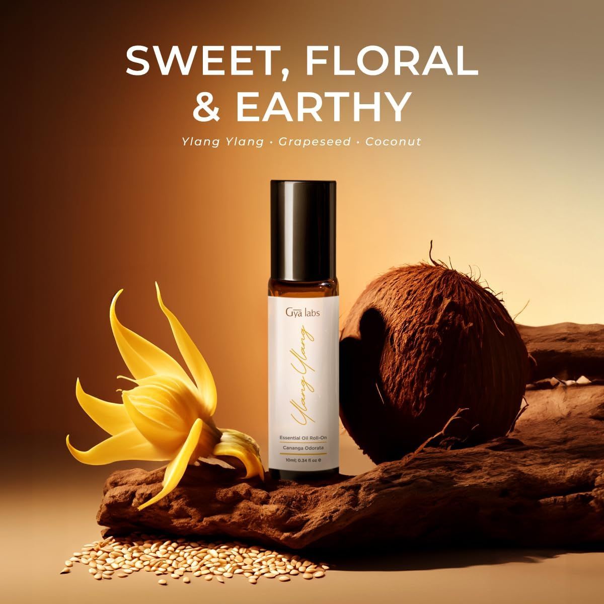 Roll-on-Flasche, Ylang Ylang, Gya Labs. Kokosnuss, Blüte und Samen daneben.