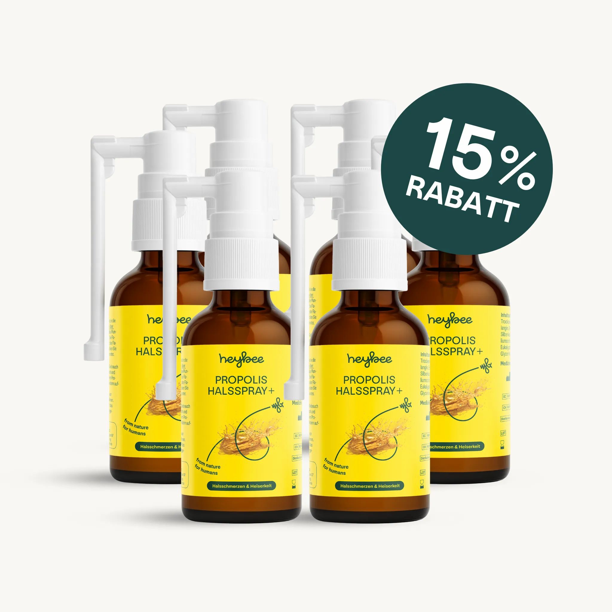 Fünf Flaschen Heybee Propolis Halsspray+ mit 15% Rabatt-Siegel. Braune Flaschen mit weißem Sprühkopf.