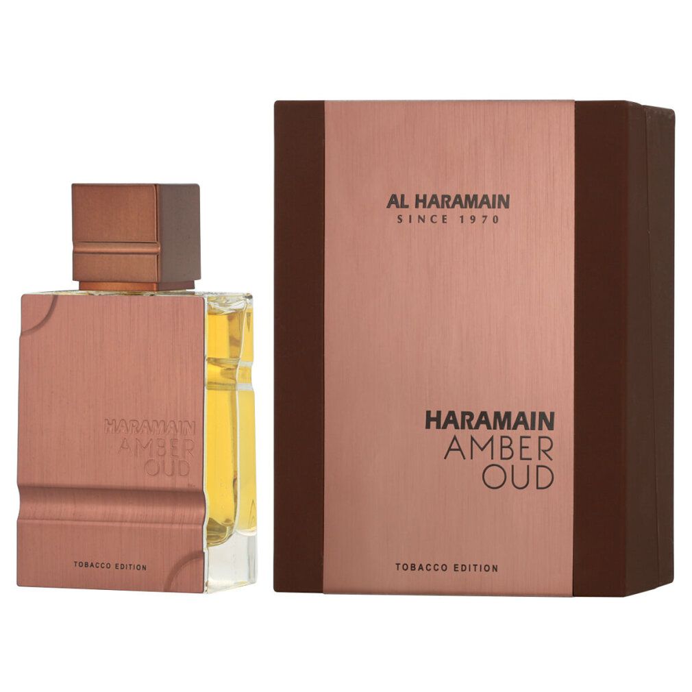 Parfümflasche und Verpackung. Aufschrift: Al Haramain, Amber Oud Tobacco Edition. Flasche und Box in Braun- und Goldtönen.