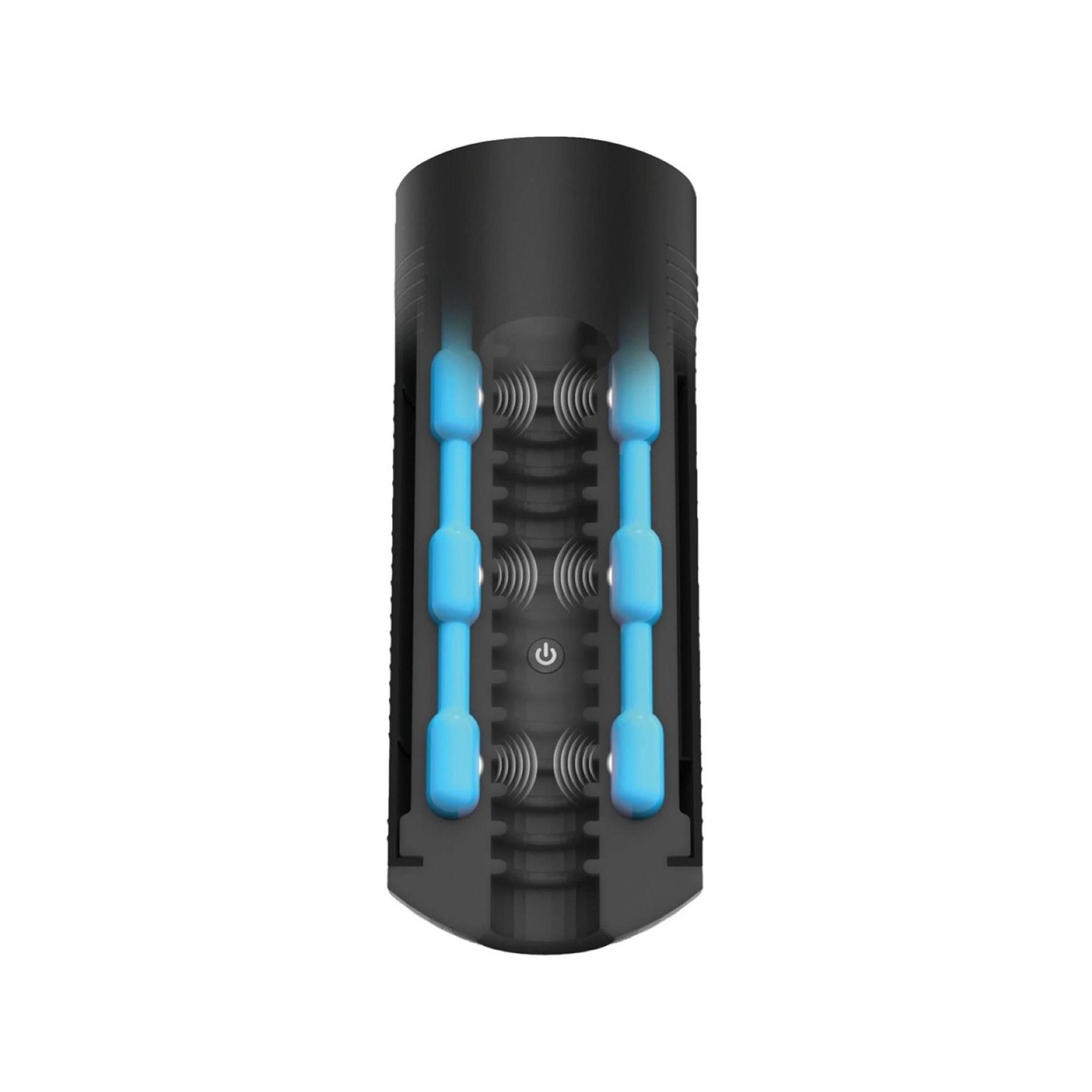 Schnitt durch einen schwarzen, zylindrischen Vibrator. Blaue Elemente im Inneren. Geriffelte Oberfläche. Unterseite mit Öffnung.