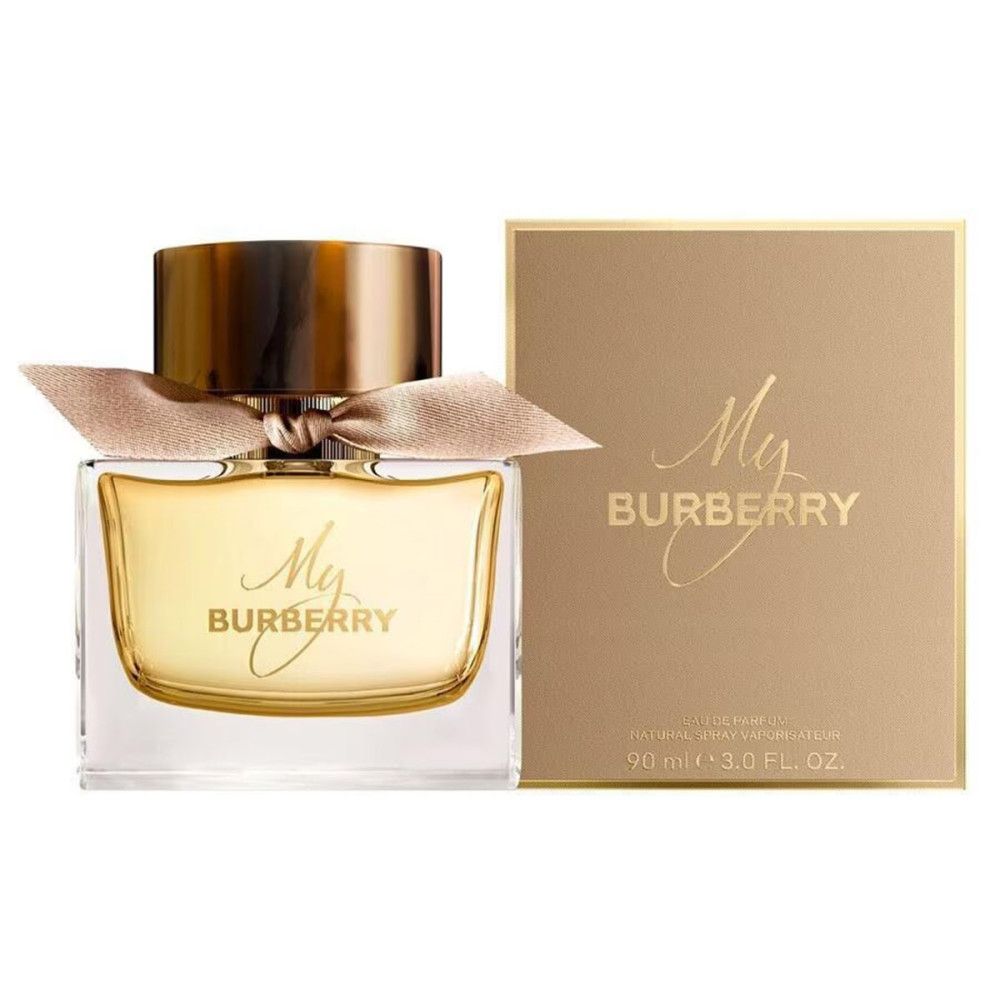 Parfümflakon und Verpackung. Flakon mit goldfarbenem Verschluss und Schleife. Verpackung mit Logo.