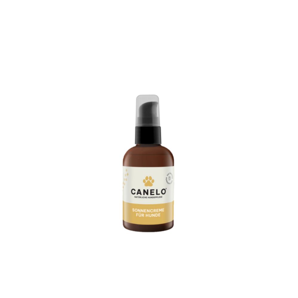 Braune Flasche mit Pumpverschluss. Auf dem Etikett steht CANELO, Sonnencreme für Hunde, mit Pfotenabdruck-Logo.
