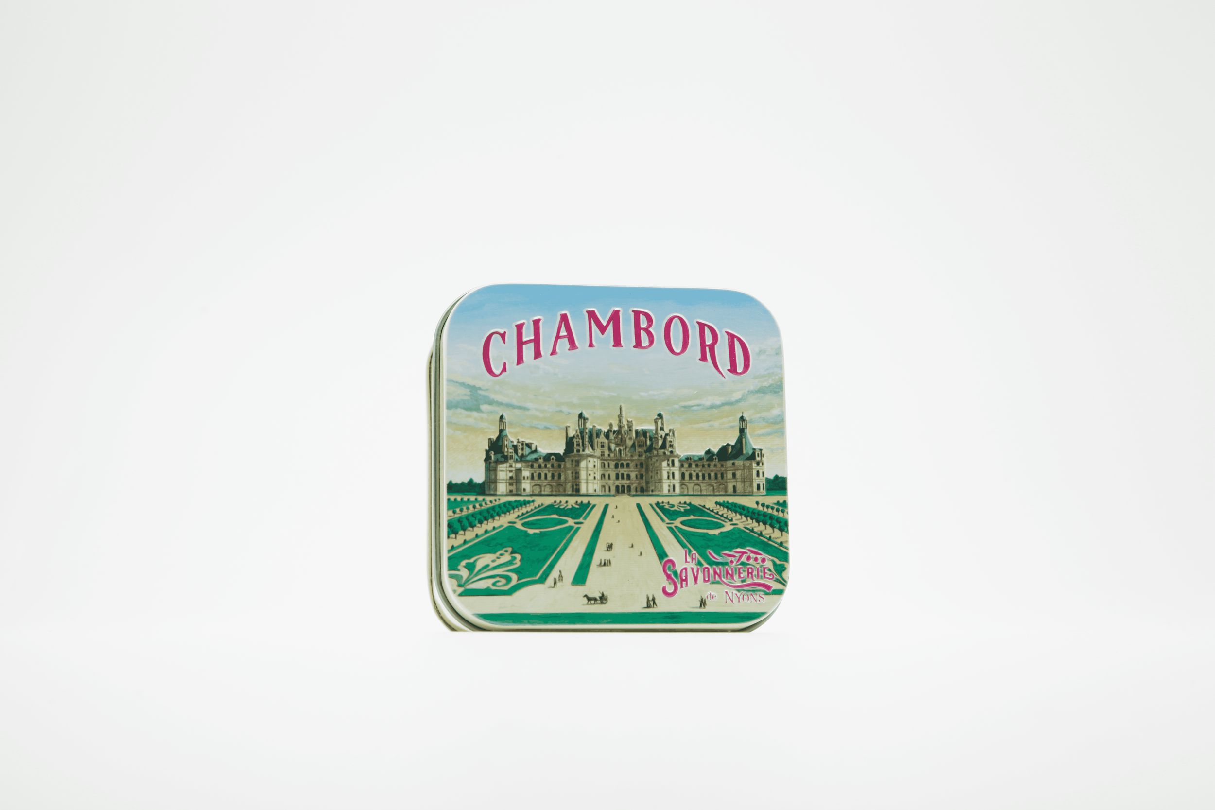Quadratische Metallbox mit Chambord-Motiv und Schriftzug. Hellblauer Deckel mit Schloss-Illustration.