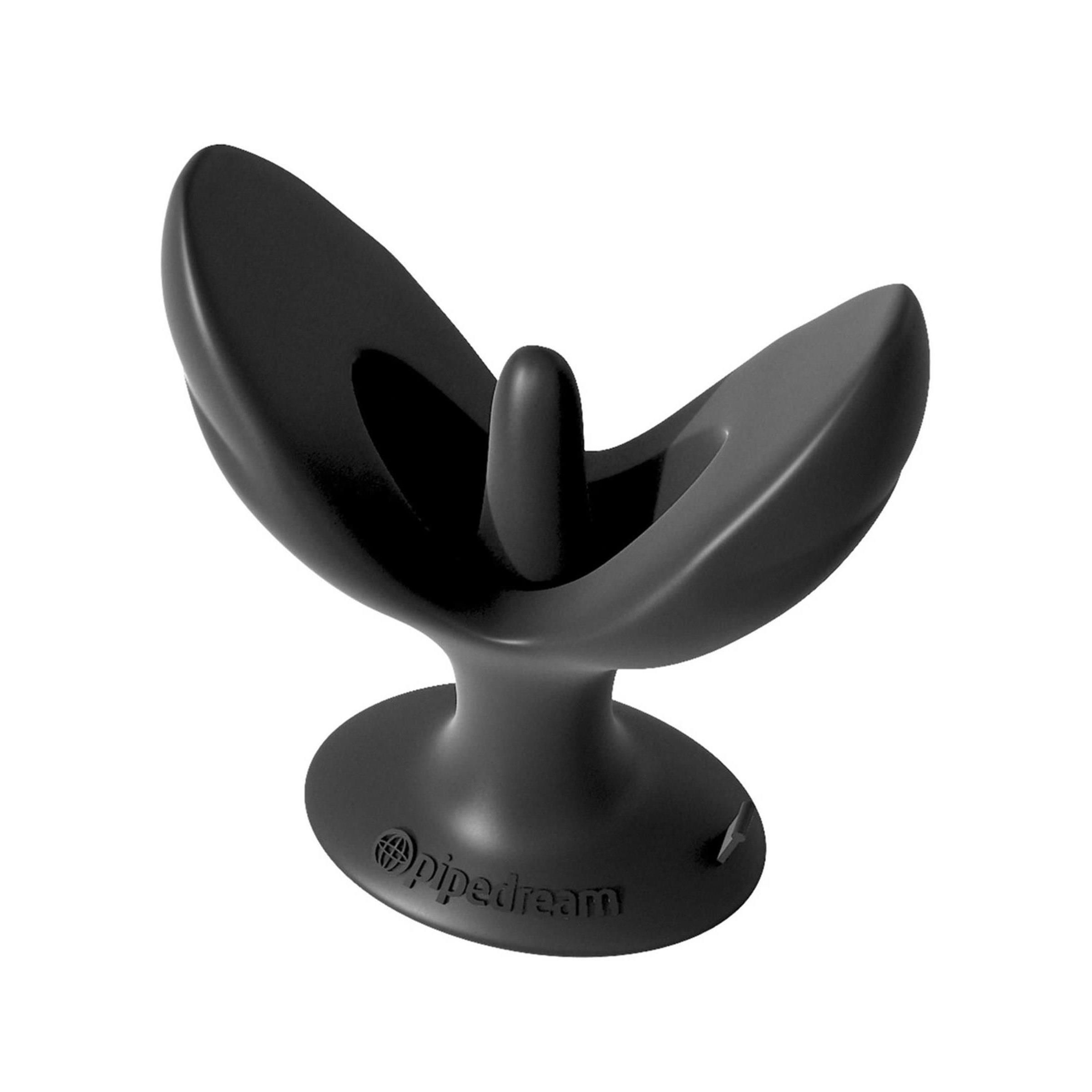 Schwarzes Wellness-Produkt. Form mit zwei Flügeln und einem zentralen Element. Basis mit Logo.