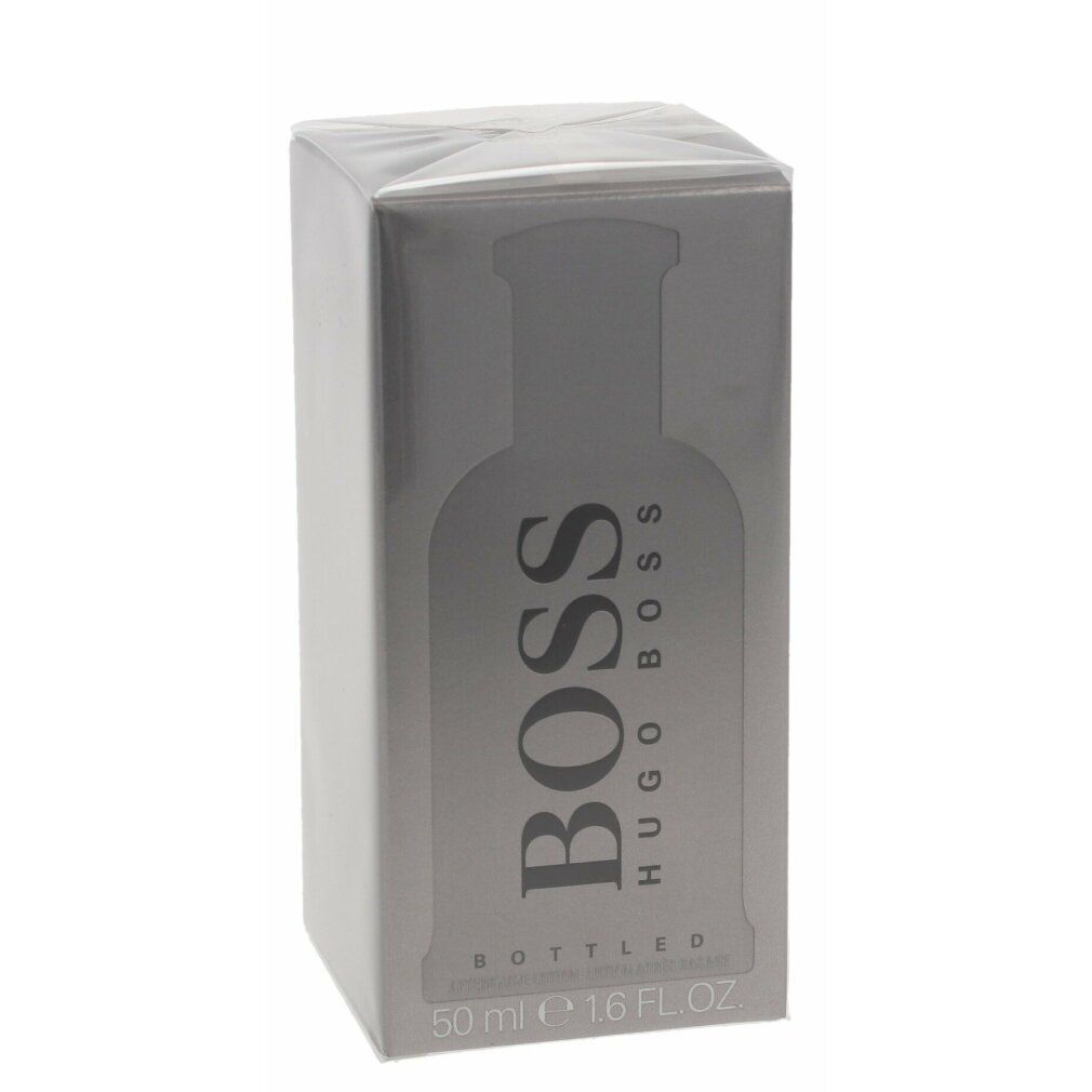 Flakon mit silbernem Verschluss. Aufschrift BOSS HUGO BOSS. Flüssigkeit farblos.