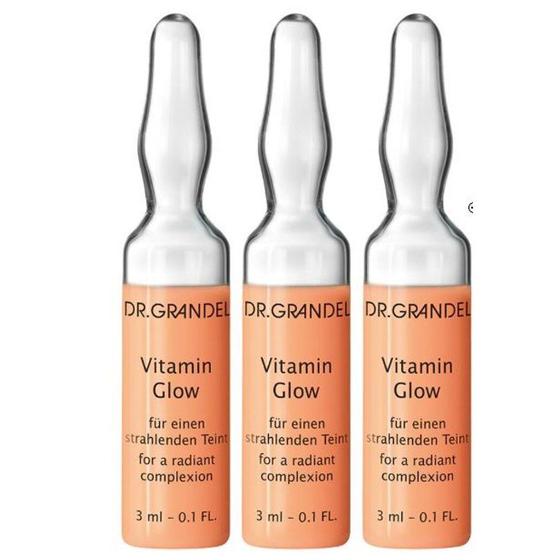 Drei Ampullen mit orangefarbenen Etiketten. Aufschrift: DR. GRANDEL Vitamin Glow. 3 ml.