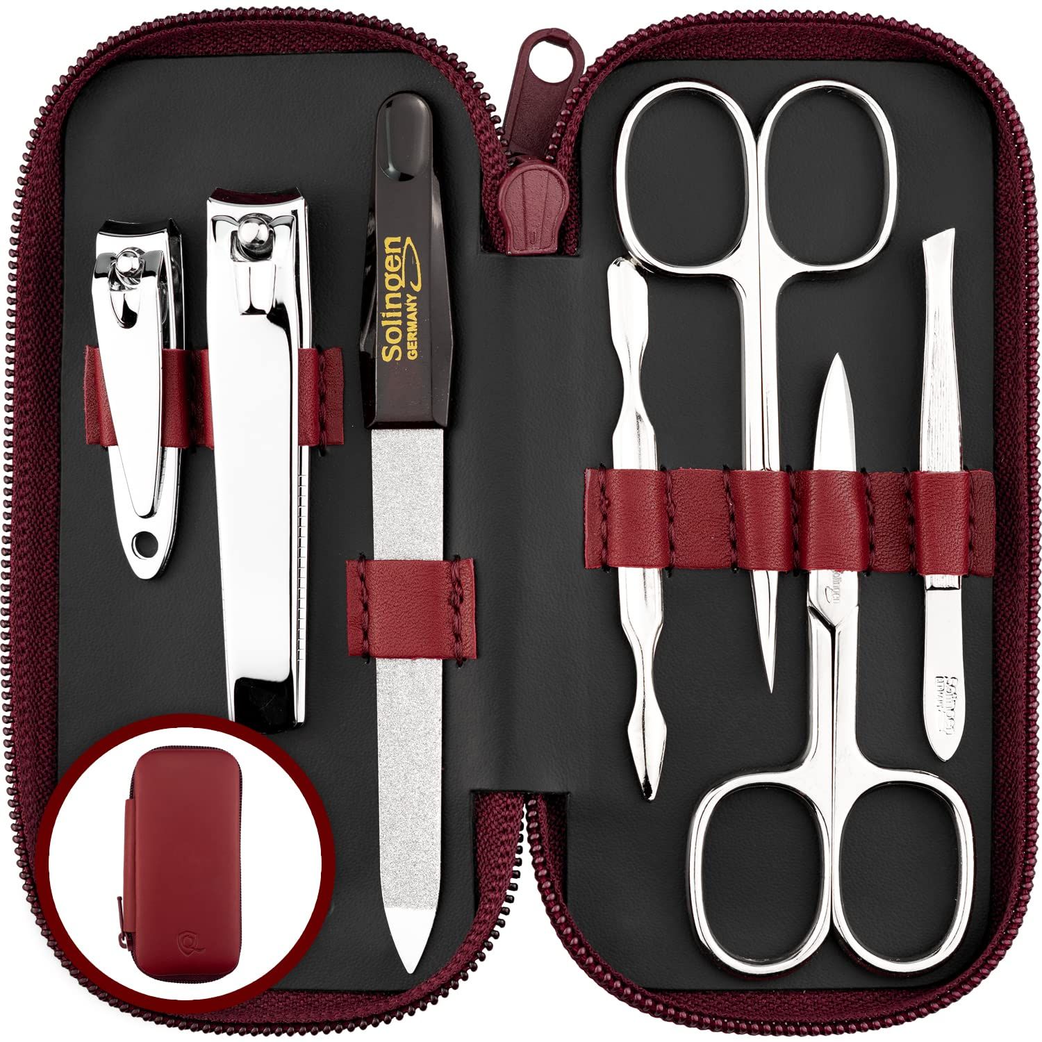 Maniküre-Set in burgunderroter Hülle, geöffnet. Enthält Nagelschere, Feile, Pinzette, Nagelknipser und weitere Werkzeuge.