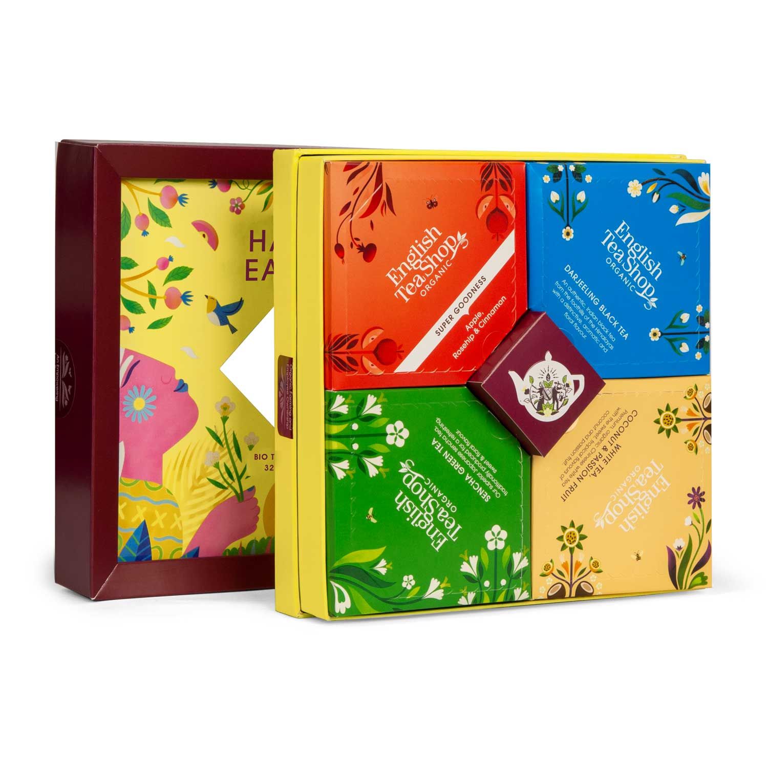 Geöffnete Geschenkbox mit Teebeuteln. Enthält vier kleine Schachteln mit verschiedenen Teesorten. Bio-Siegel und Markenlogo.