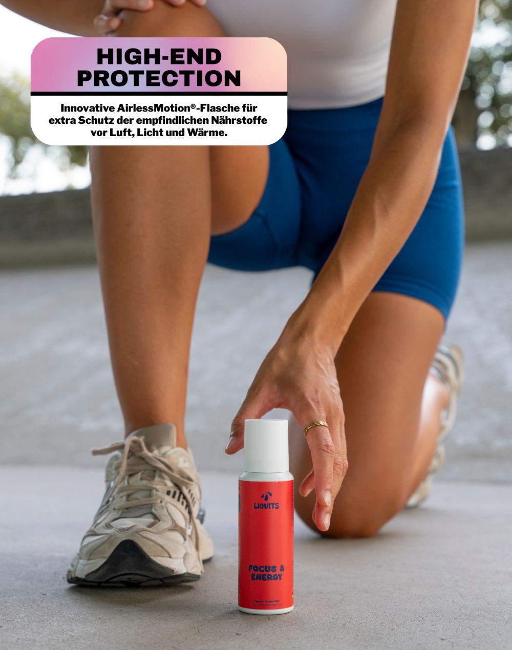 Rote Flasche mit weißem Deckel. Aufschrift: FOCUS & ENERGY. Frau hält Flasche. Text: HIGH-END PROTECTION.