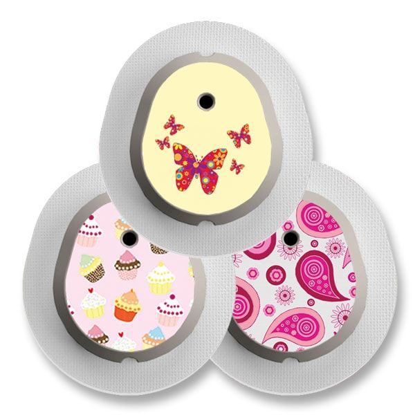 Drei Aufkleber für medizinische Geräte mit verschiedenen Mustern: Schmetterling, Cupcakes und Paisley. Runde Form mit Loch.