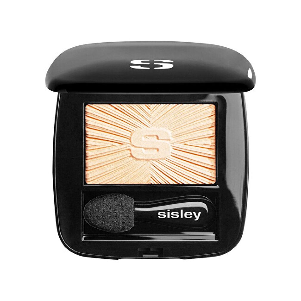 Geschlossene schwarze Sisley Lidschatten-Palette. Heller Lidschatten mit Sonnenmuster. Applikator mit Marke. Deckel mit Logo.