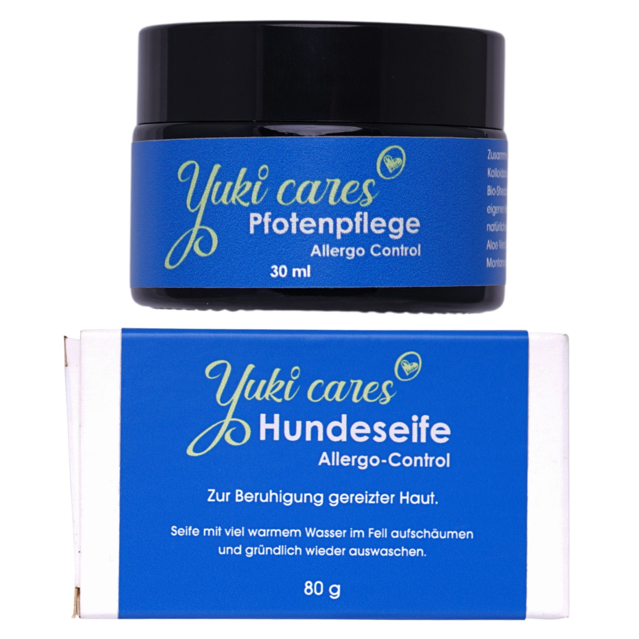 Creme- und Seifenverpackung. Die Creme hat einen schwarzen Deckel und ein blaues Etikett mit Text. Die Seife ist in einer weißen Schachtel mit blauem Etikett verpackt.