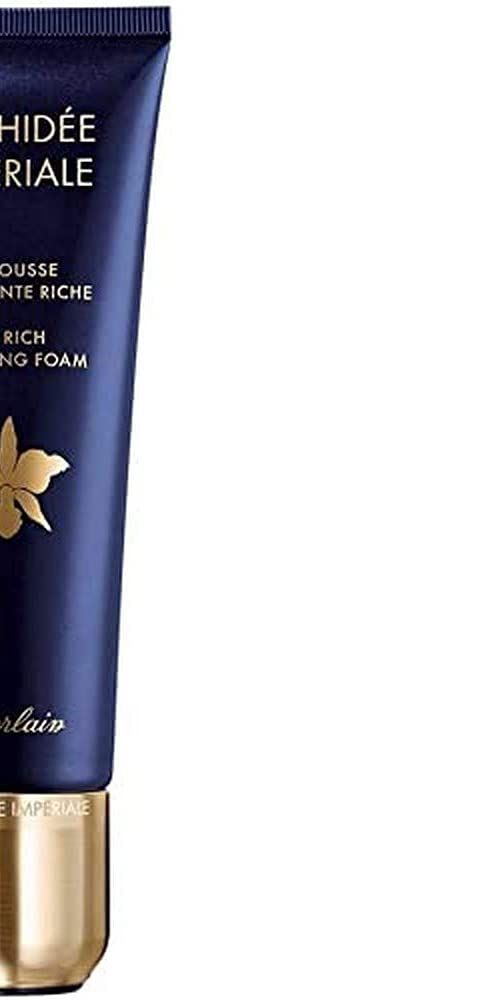 Blaue Tube mit goldenen Akzenten. Enthält "ORCHIDÉE IMPÉRIALE" und "THE RICH CLEANSING FOAM". Marke Guerlain sichtbar.