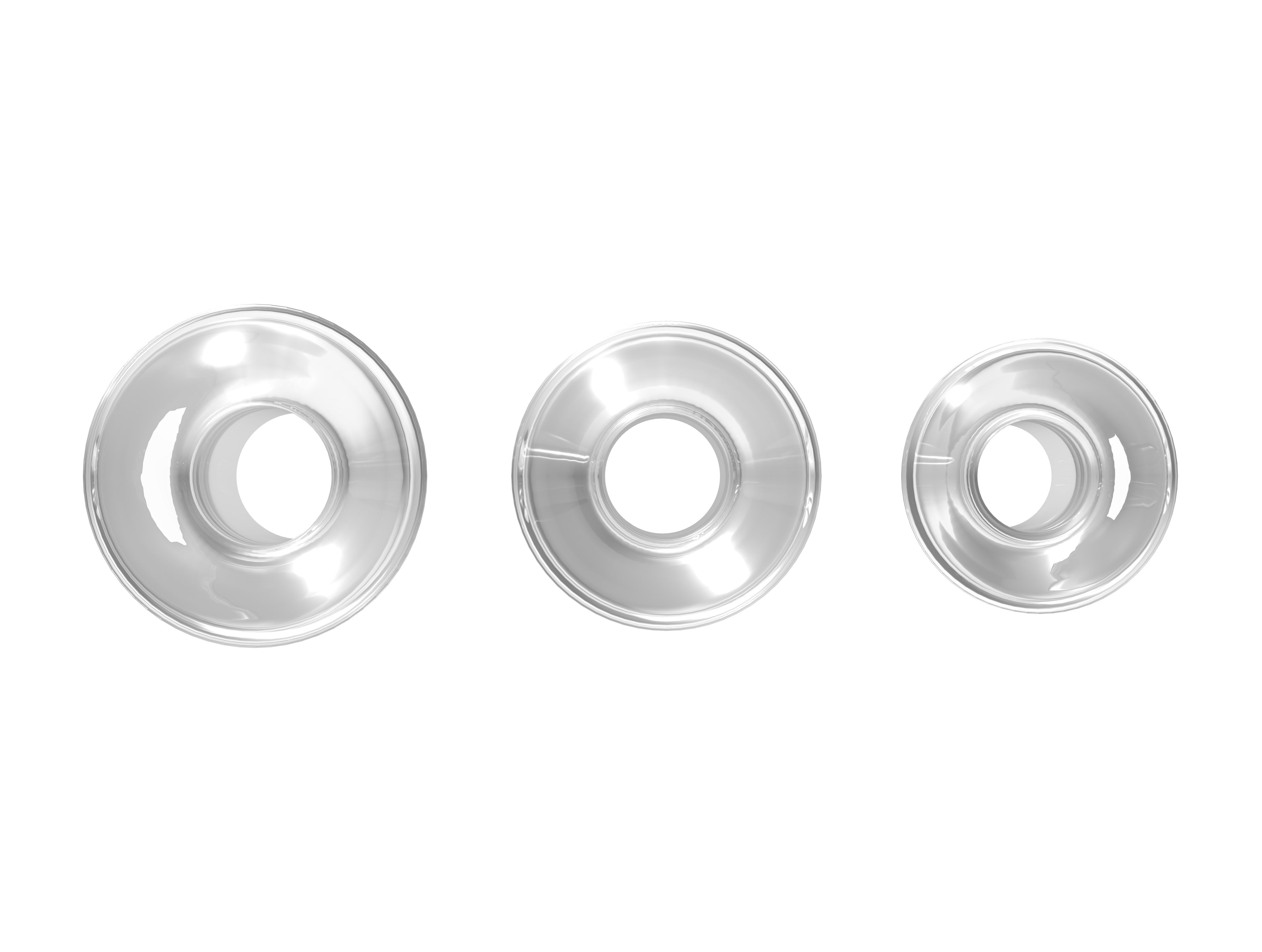 Drei transparente Anal-Plugs von oben gesehen. Sie haben eine runde Form mit einem Loch in der Mitte.