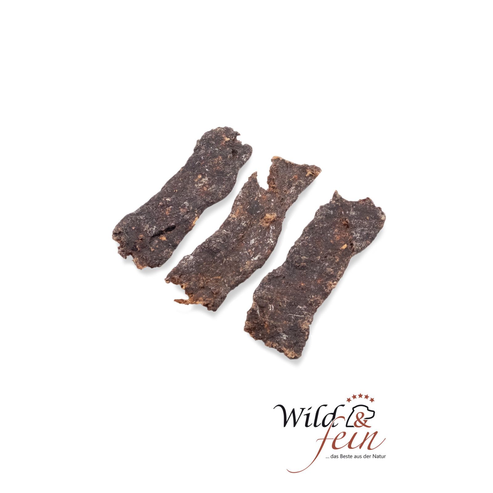 Drei Rehfleischstreifen. Dunkelbraune, längliche Form. Aufschrift "Wild & fein".