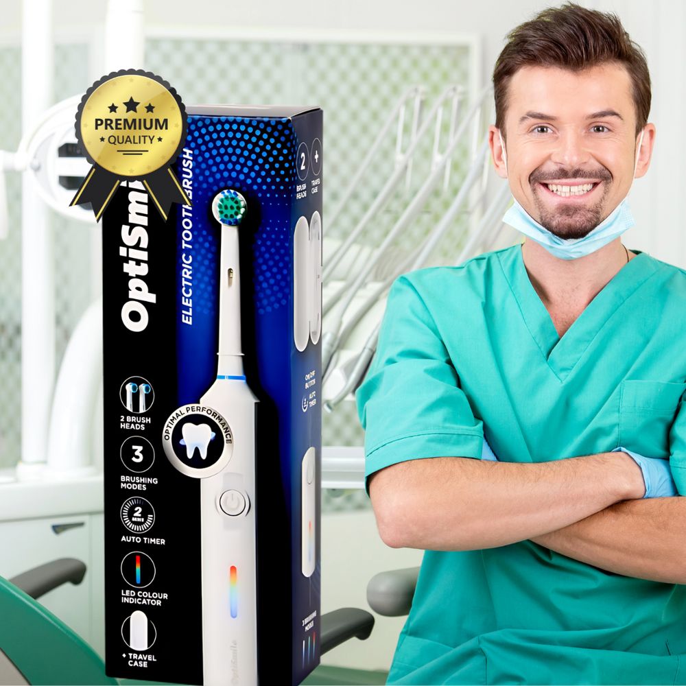 OptiSmile elektrische Zahnbürste in Verpackung. Zahnarzt im Hintergrund. Premium Qualität Siegel.