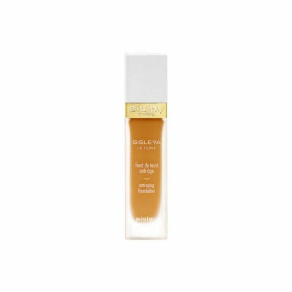 Sisley Sisleya Le Teint Foundation. Rechteckige Flasche mit weißem Deckel. Goldener Schriftzug Sisley Paris. Anti-Aging-Foundation.