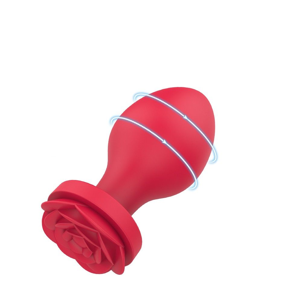 Roter Analplug mit Rosenbasis. Blaue Linien zeigen eine mögliche Bewegungsrichtung.
