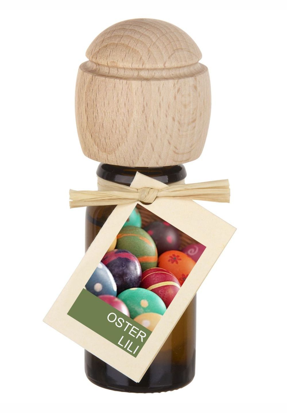 Braune Glasflasche mit Holzverschluss und Anhänger. Anhänger mit bunten Ostereiern. Aufschrift: OSTER LILI.