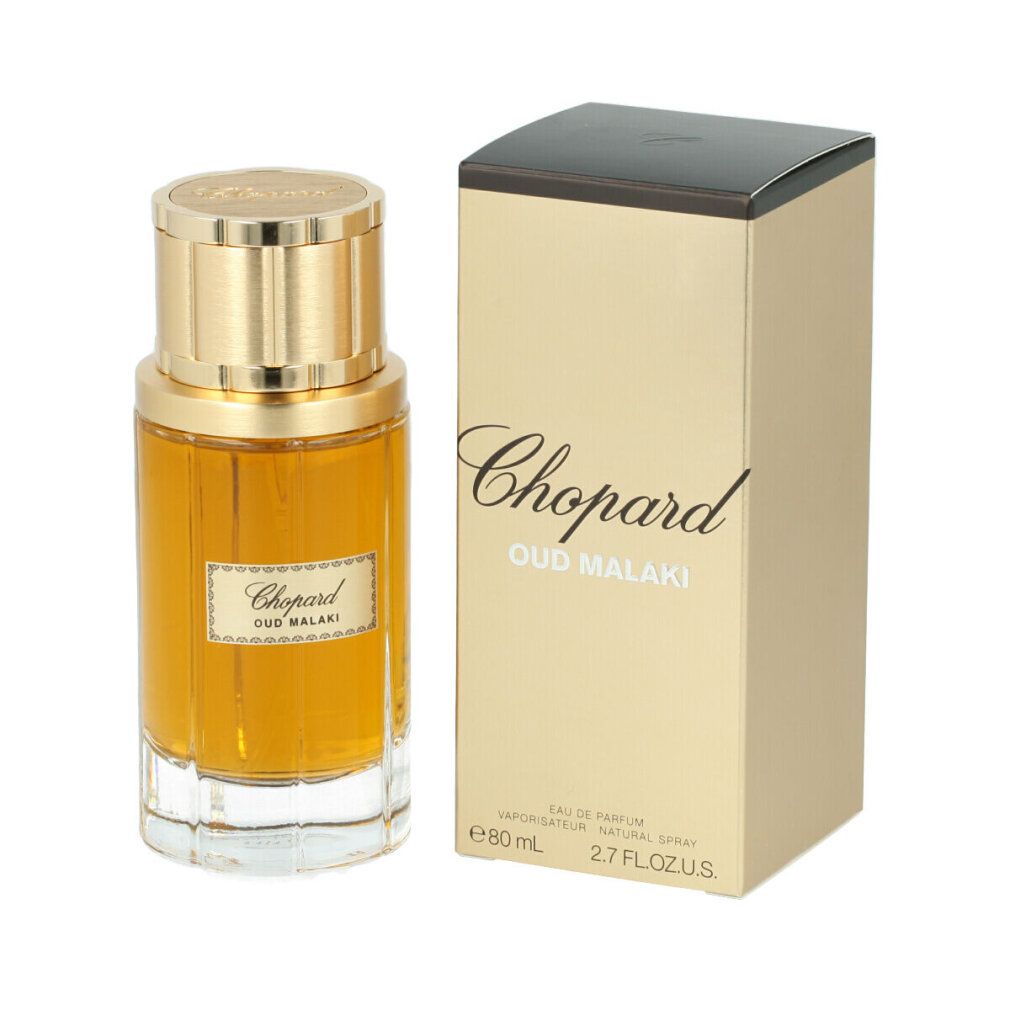 Parfümflasche und Verpackung. Goldfarbene Flasche mit goldfarbenem Deckel. Aufschrift: Chopard Oud Malaki. Verpackung mit Schriftzug.
