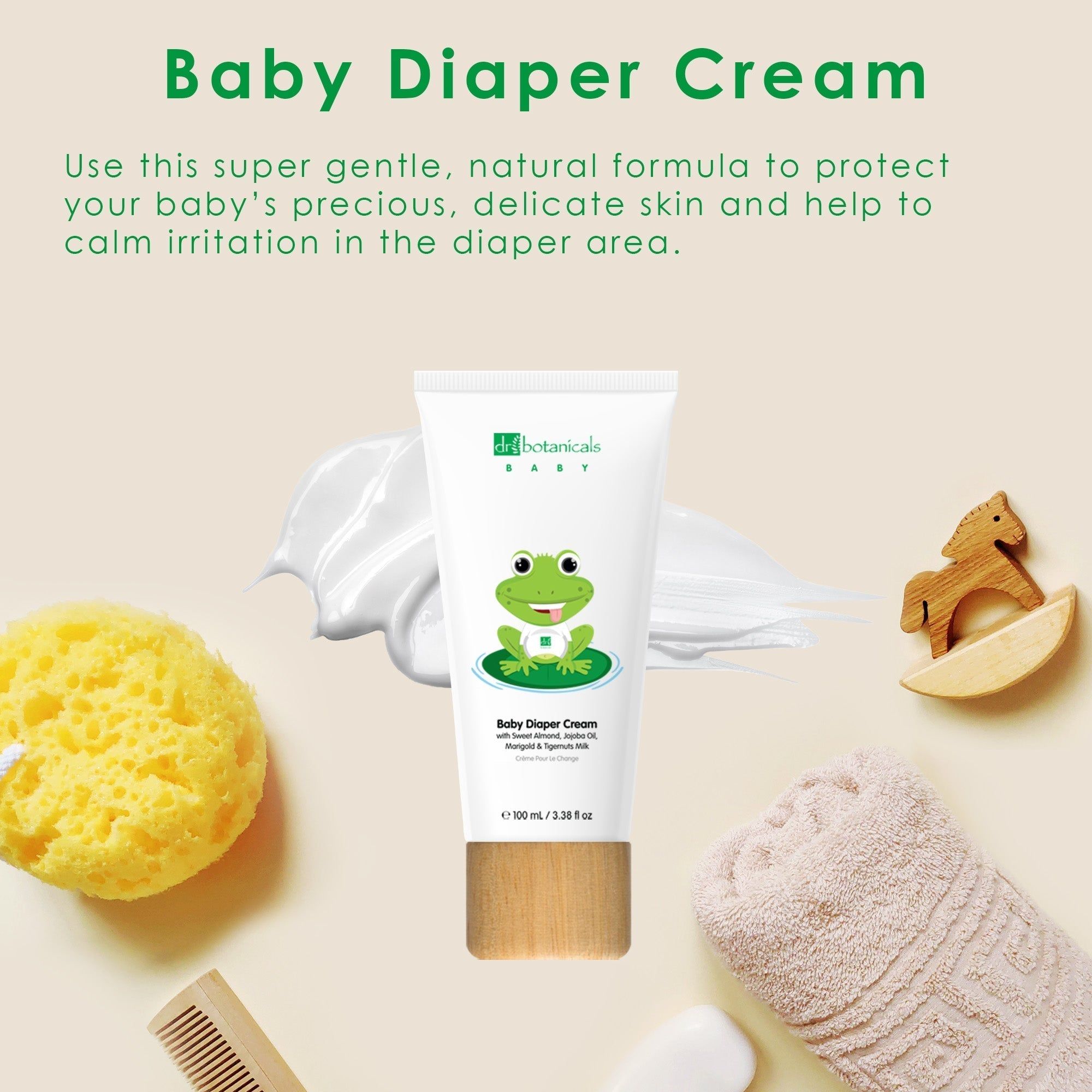 Creme-Tube mit Frosch-Illustration. Aufschrift: Baby Diaper Cream. Neben Creme, Schwamm, Holzpferd.