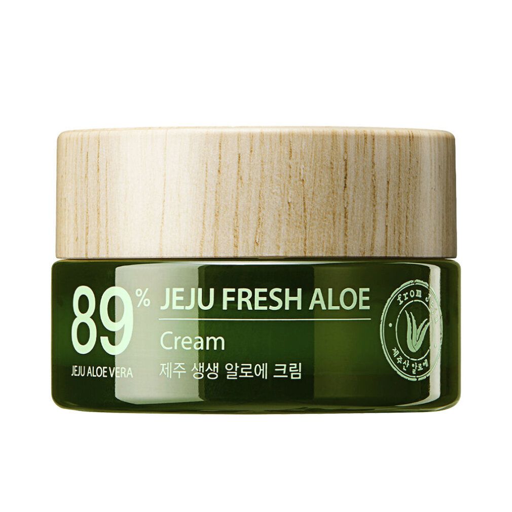 Cremeglas mit Holzdeckel. Aufschrift: 89% Jeju Fresh Aloe Cream. Text in Englisch und Koreanisch. Grünes Glas.