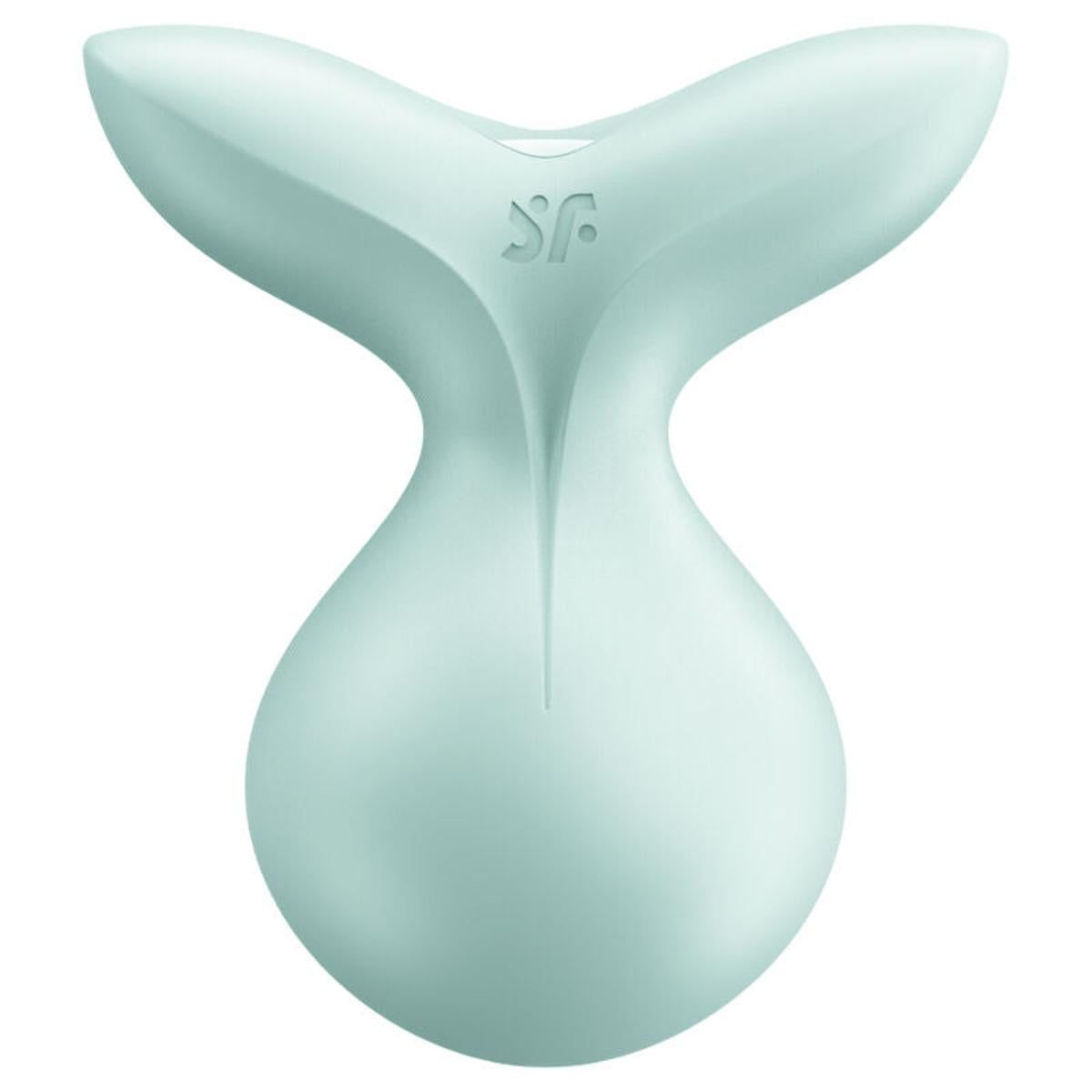 Hellgrüner Auflegevibrator mit geschwungener Form. Oberteil mit zwei Flügeln, Unterteil rundlich. Logo 'sf'.