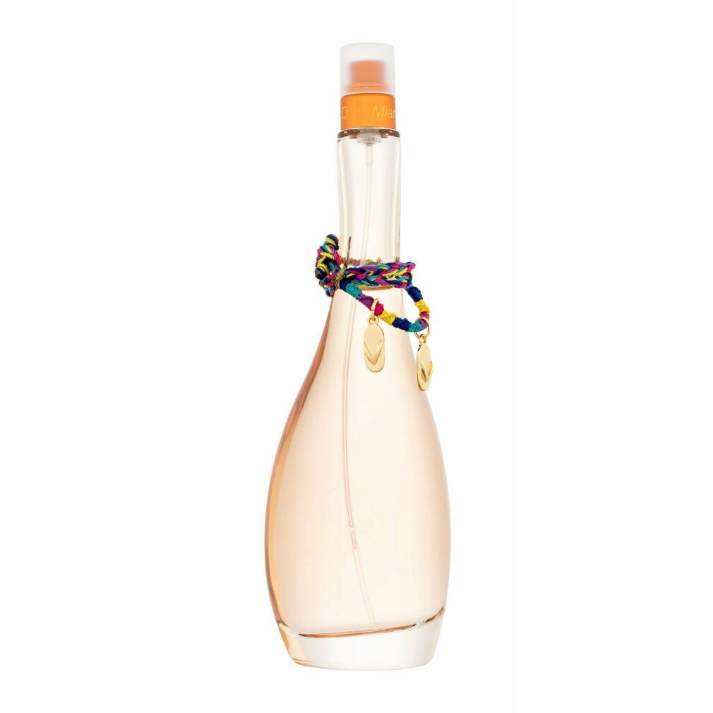 Parfümflasche mit farbigem Schmuckband. Transparente Glasflasche mit orangefarbenem Sprühkopf. Flasche ist tropfenförmig.