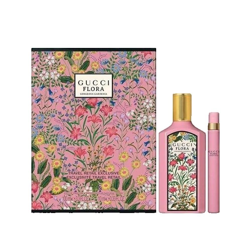 Gucci Flora Gorgeous Gardenia Parfum Femme. Rosa Flakon mit goldfarbenem Deckel, rosa Zerstäuber und floral bedruckte Verpackung.