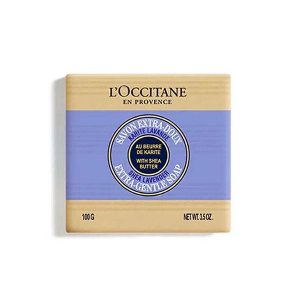 Rechteckige Seife mit lila Band und rundem Logo. Aufschrift: L'Occitane, Savon Extra-Doux Karité Lavande, Shea Lavender. 100g, Net Wt. 3.5 oz.