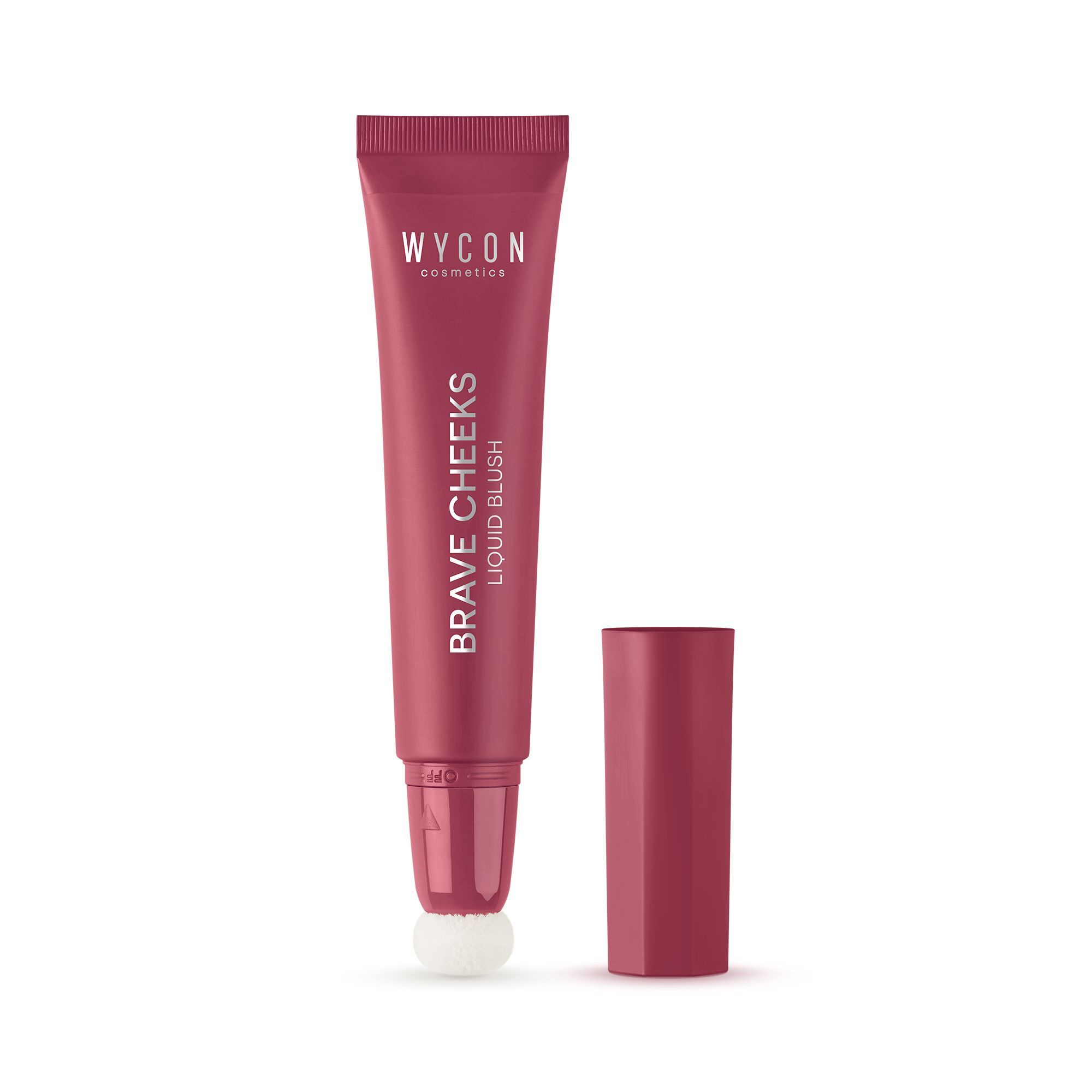 WYCON cosmetics Brave Cheeks Liquid Blush. Tubo con applicatore a spugna e tappo separato. Nome del prodotto visibile.