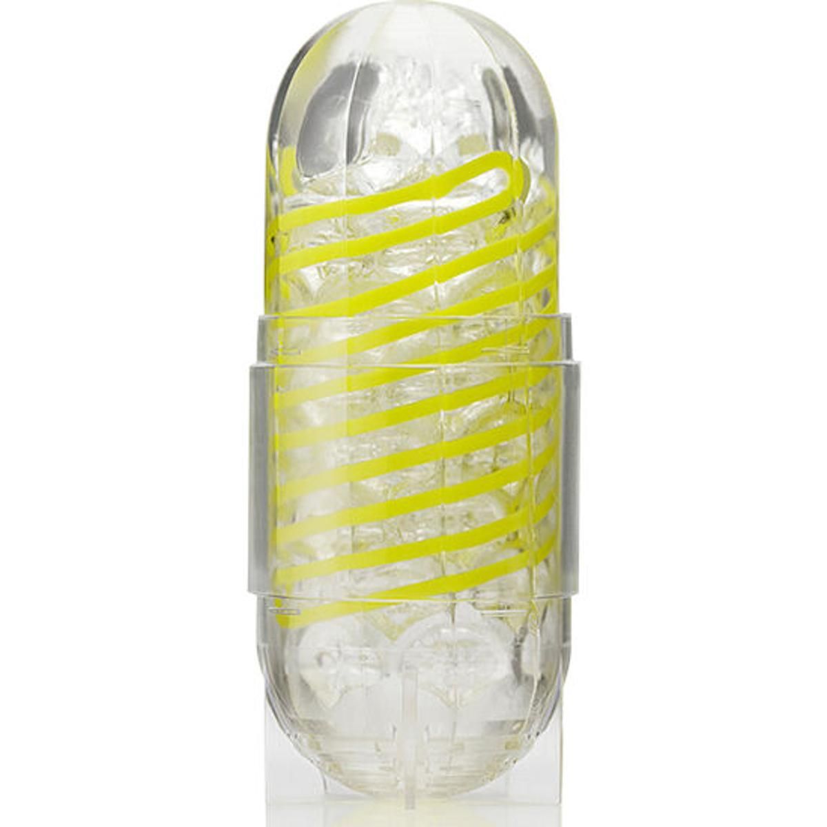 Transparenter, länglicher Gegenstand mit gelben Spiralen. Innenstruktur sichtbar.