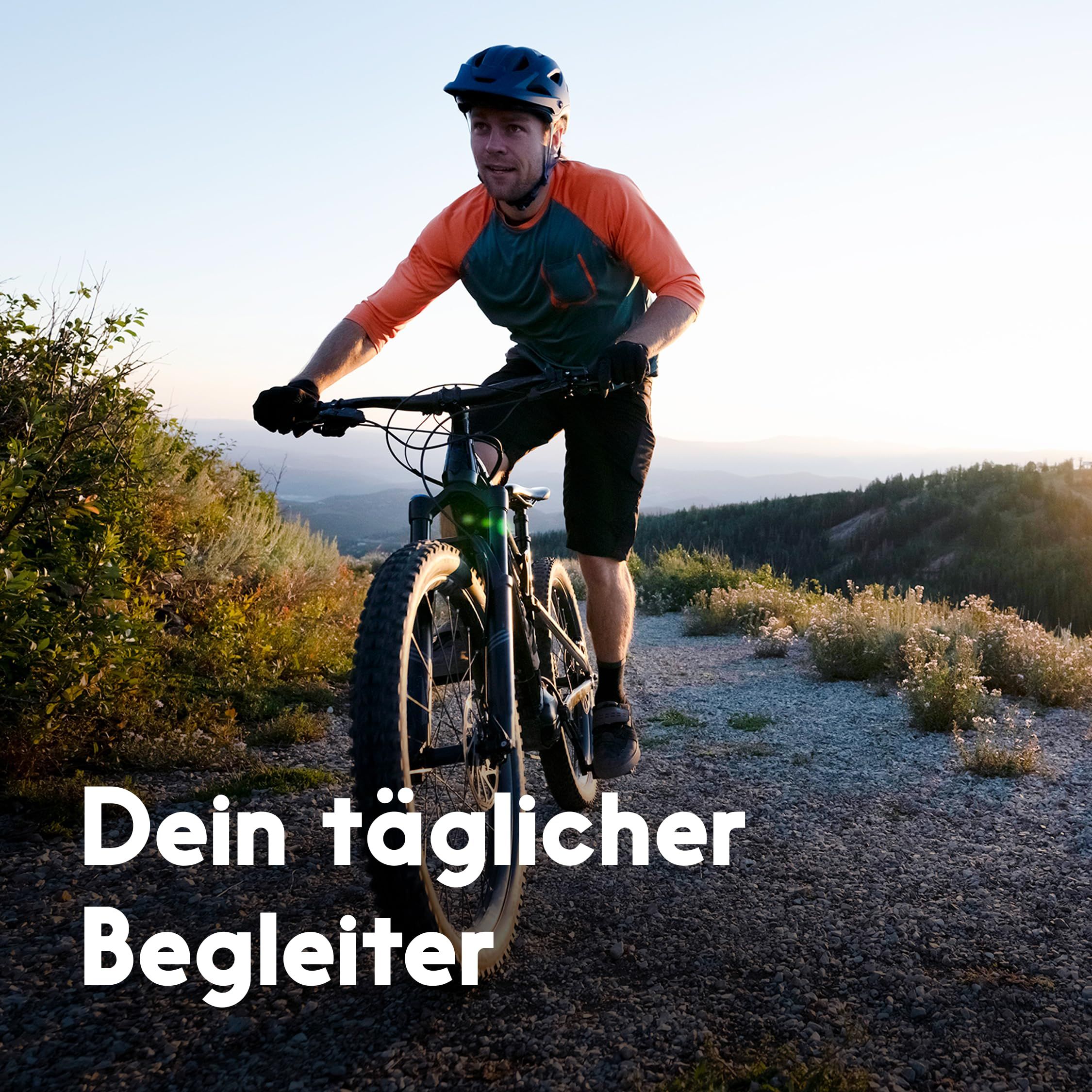 Mann fährt Fahrrad auf einem Weg. Text: Dein täglicher Begleiter.