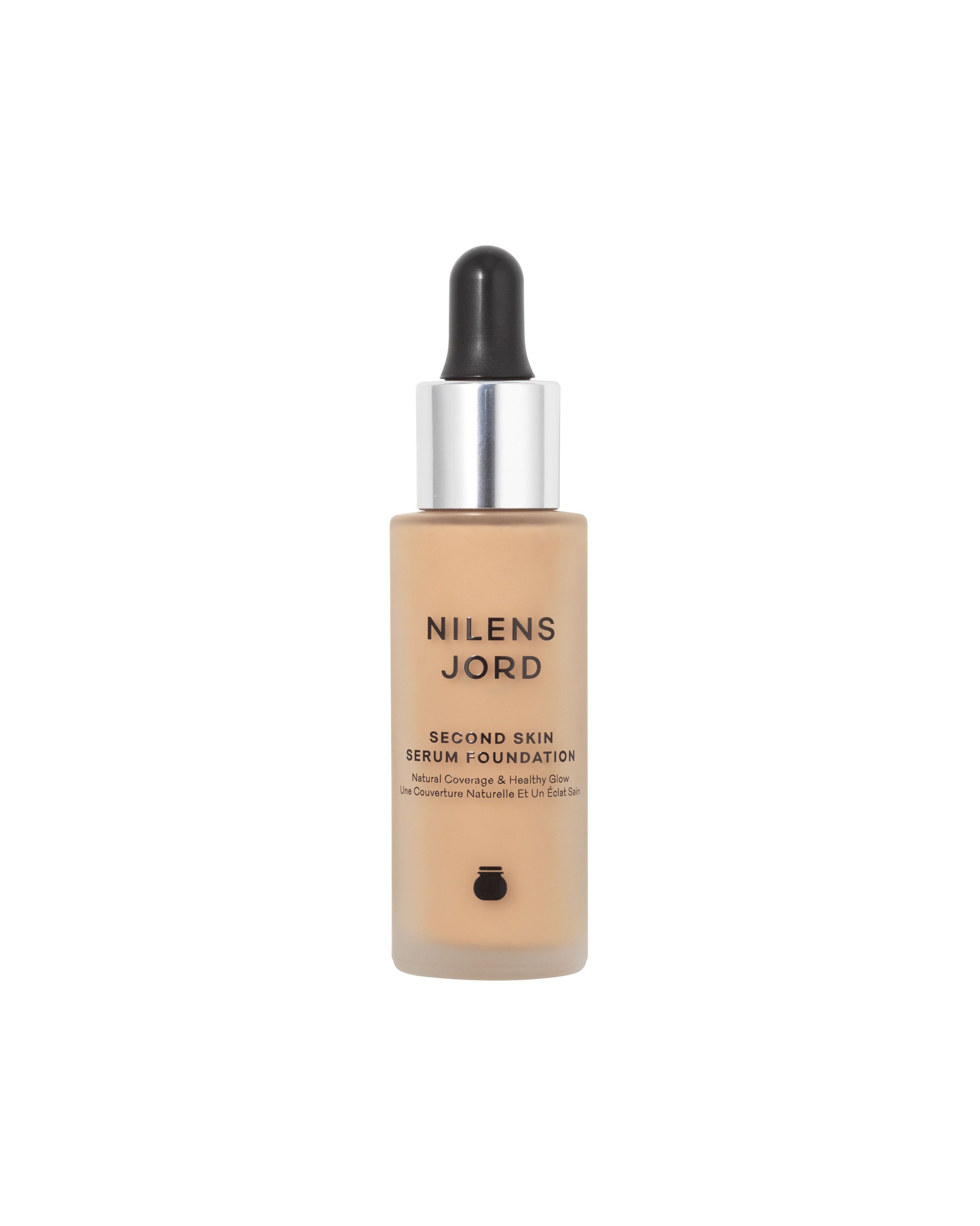 Nilens Jord Second Skin Serum Foundation in einem Glasfläschchen mit Pipette. Natürliche Deckkraft und gesunder Glanz.