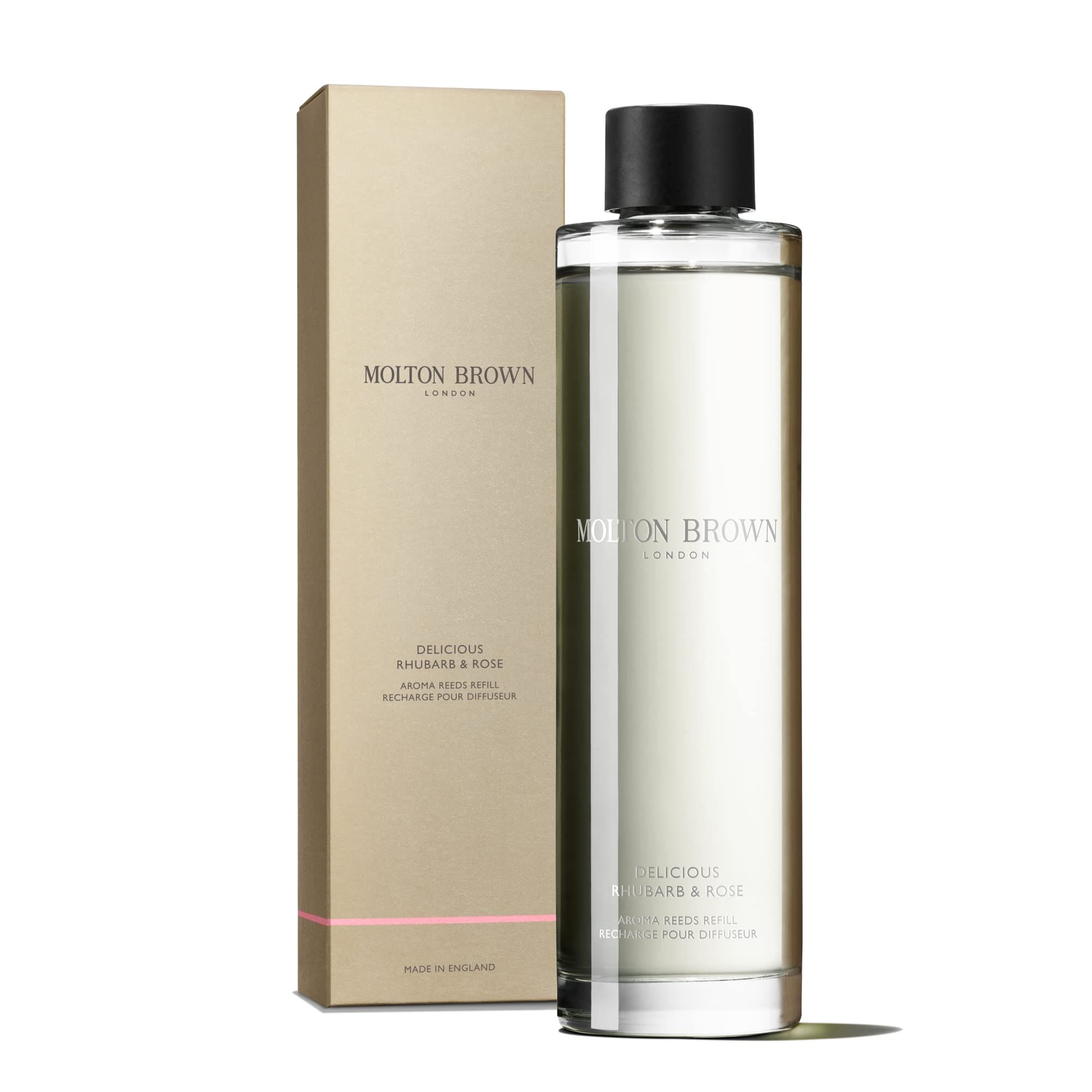 Molton Brown Duftstäbchen Nachfüllpackung, transparente Flasche mit schwarzem Deckel und goldfarbener Verpackung. Text: Delicious Rhubarb & Rose.