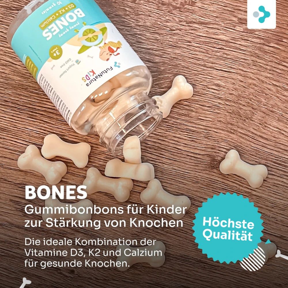 FutuNatura Kids Bones Gummies Flasche und Knochen-Gummibärchen auf Holz. Text: Bones, Gummibonbons für Kinder. Qualitätssiegel.