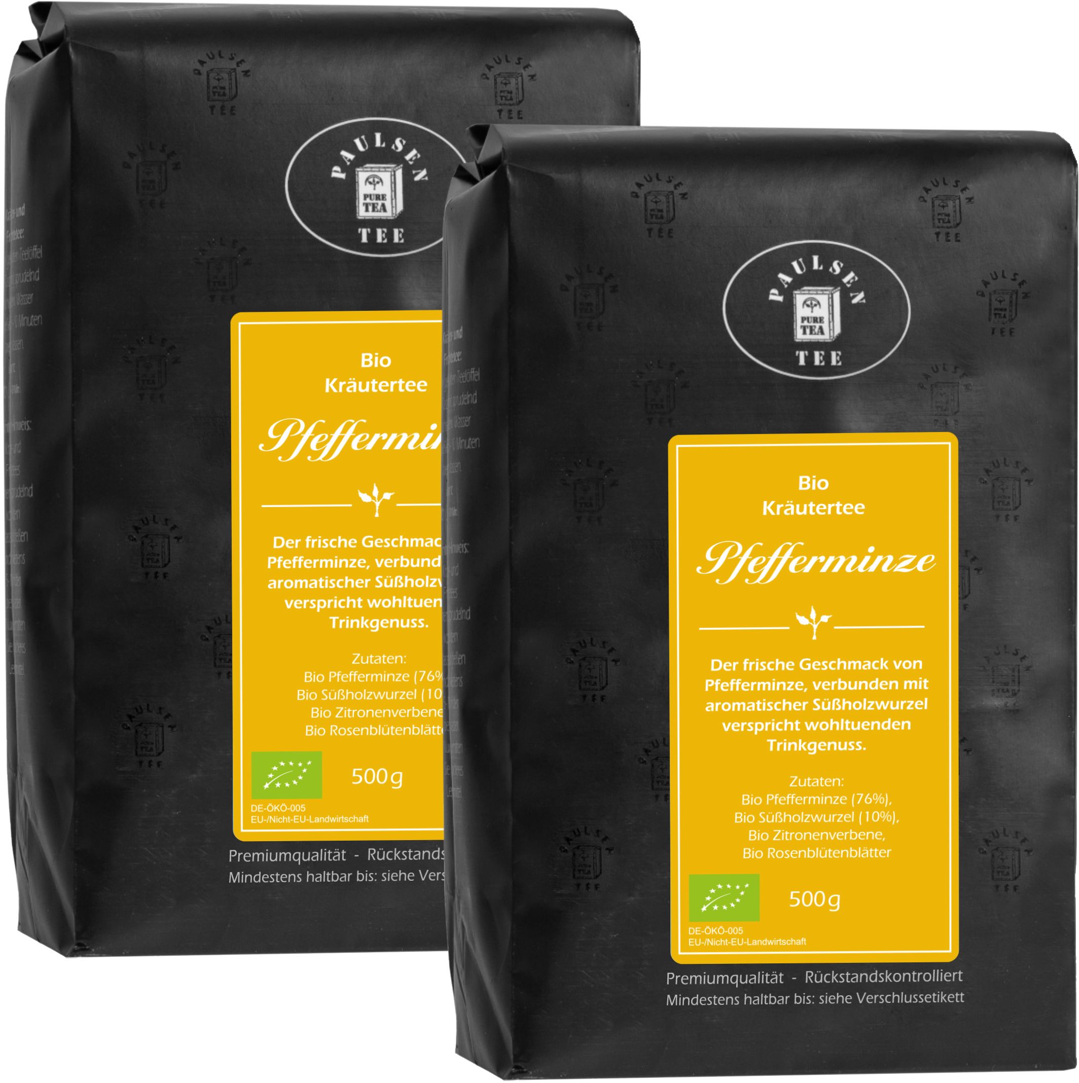 Zwei schwarze Beutel mit gelben Etiketten. Aufschrift: Paulsen Tee, Bio Kräutertee Pfefferminze. Mit Bio-Siegel und 500g Angabe.